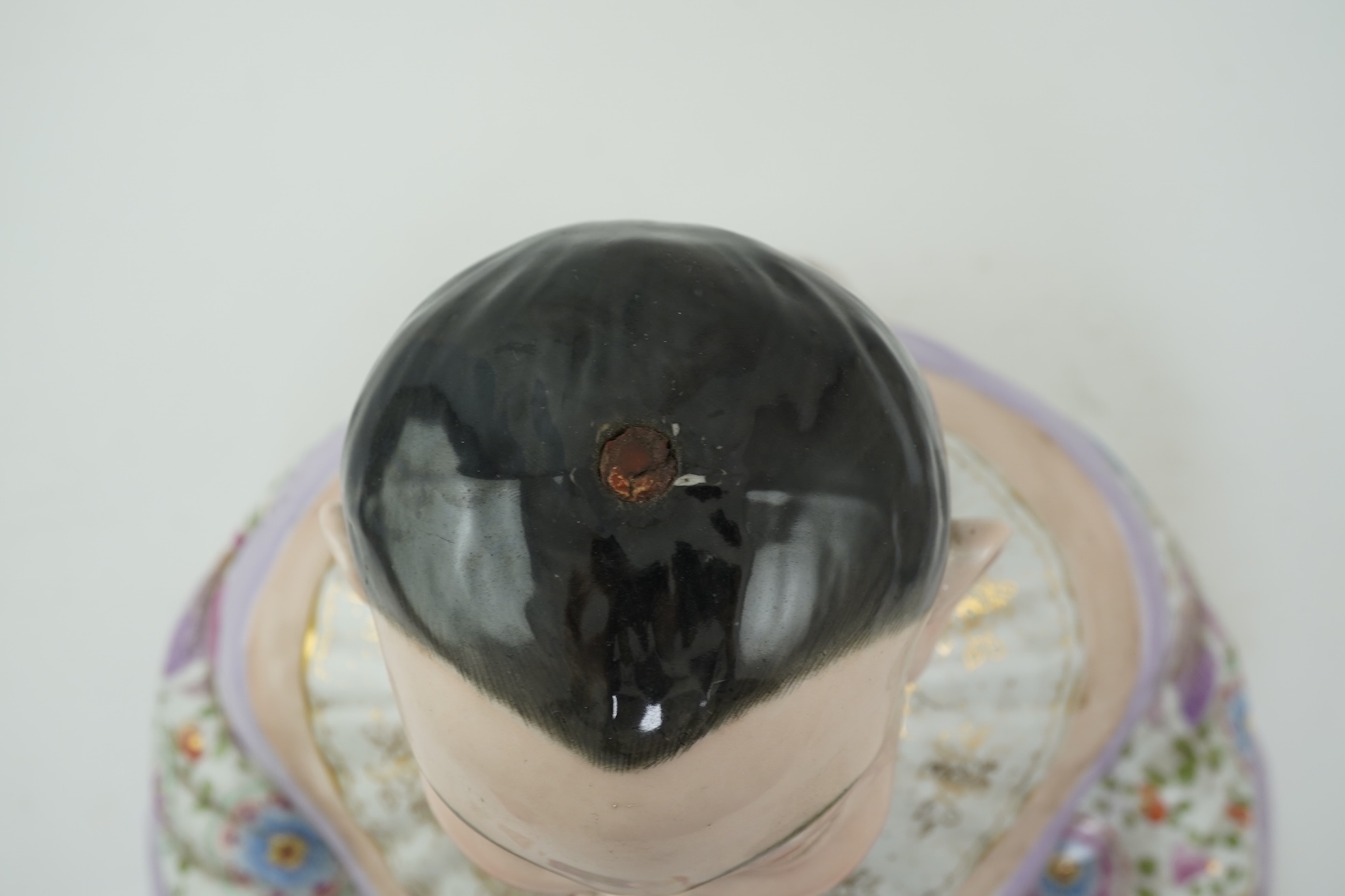 A large Continental porcelain figure of a seated nodding Buddha, early 20th century